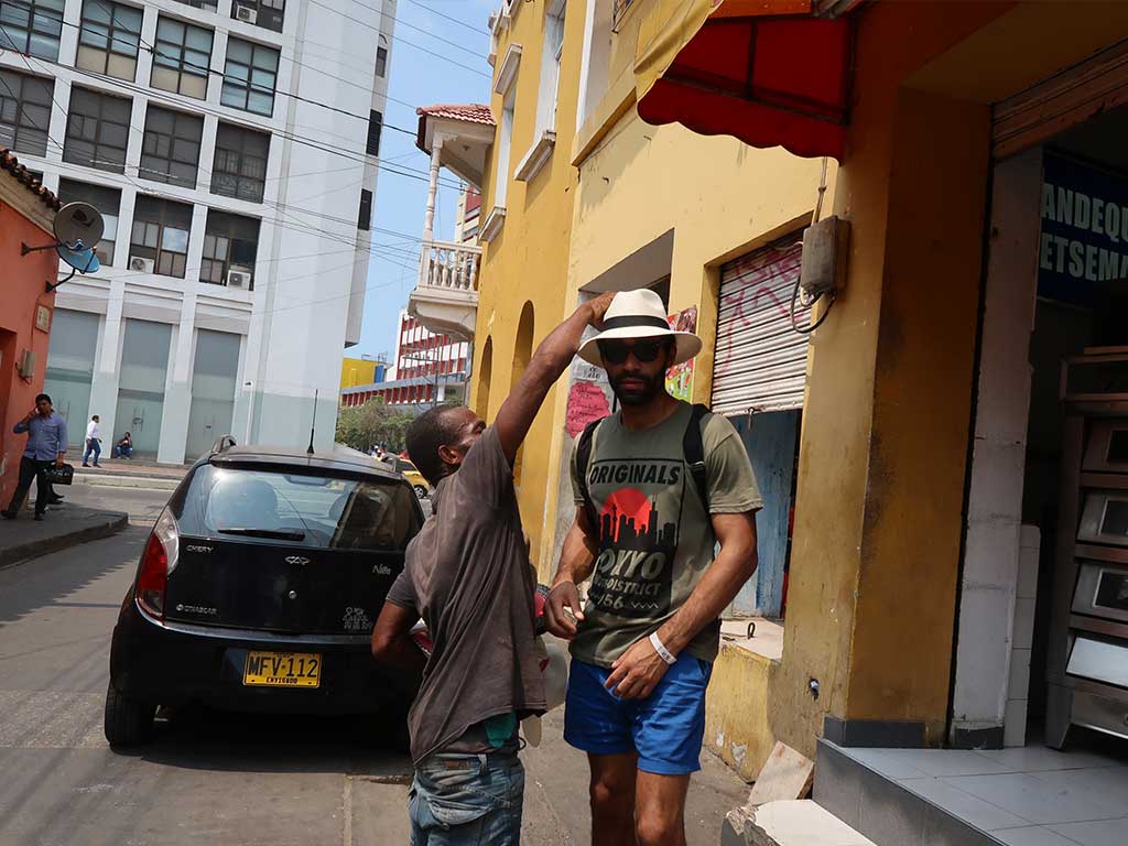 things to do in cartagena getsemani street vendors hats